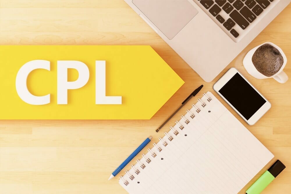 Costs per Lead CPL image with notepad, laptop, cell phone, pens and coffee artistically organized