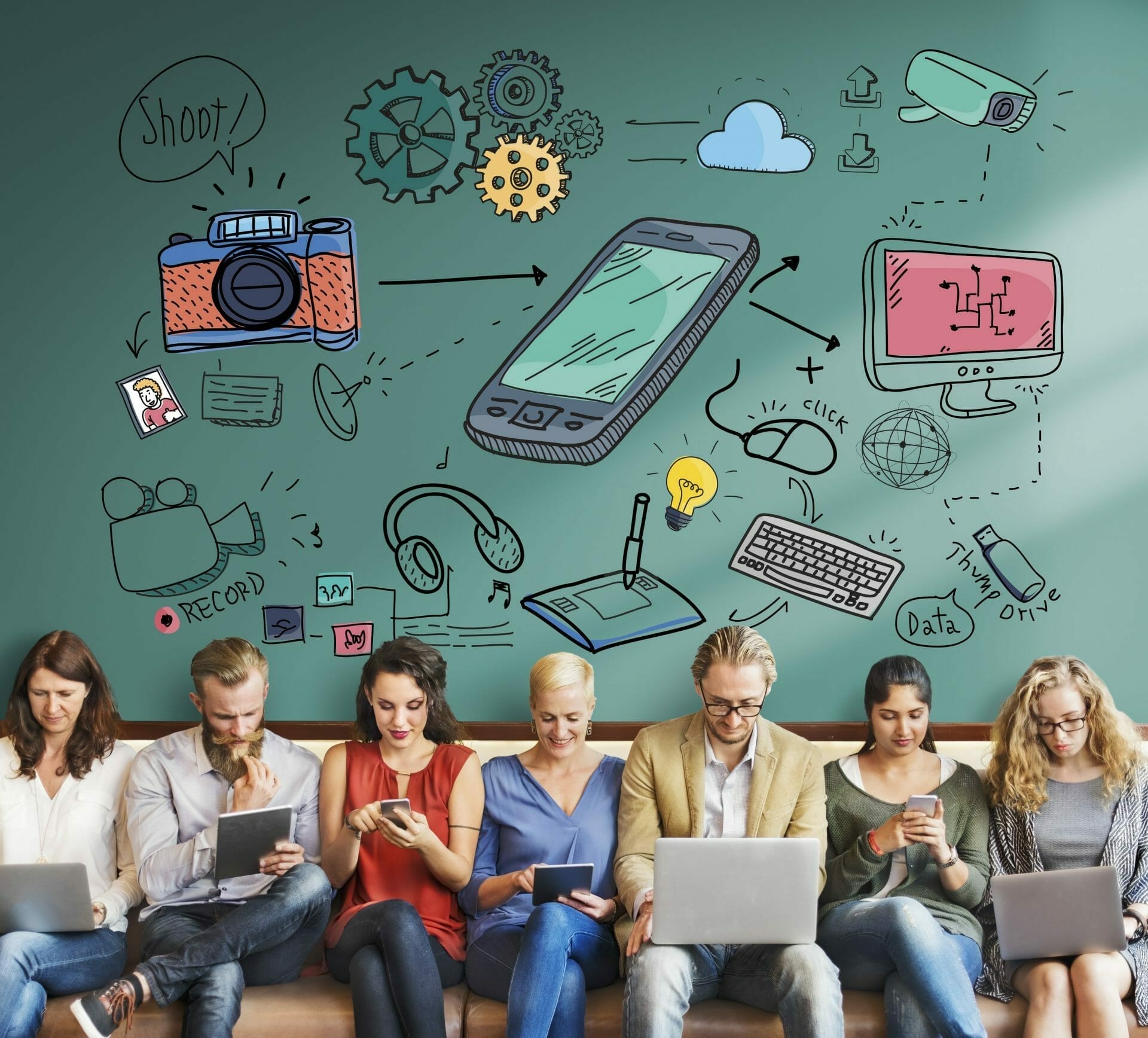 7 people all sitting on a bench using cell phones, tablets, and laptops