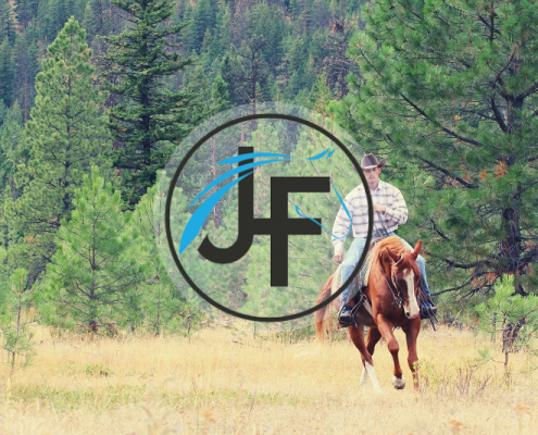 Jonathan Field Horsemanship featured image of a cowboy on a horse in a clearing.