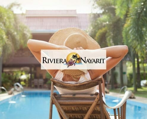 Riviera Nayarit promo image of woman in chair beside a hotel pool
