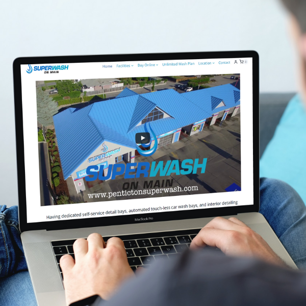 Laptop computer displaying Superwash on Main website