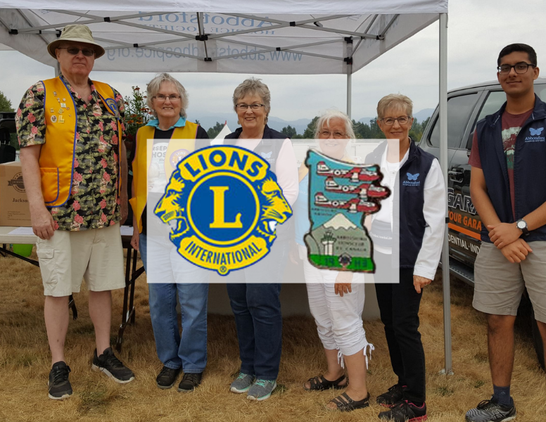 International Lions Club Logo over a photo of the Abbotsford Lions Club members.