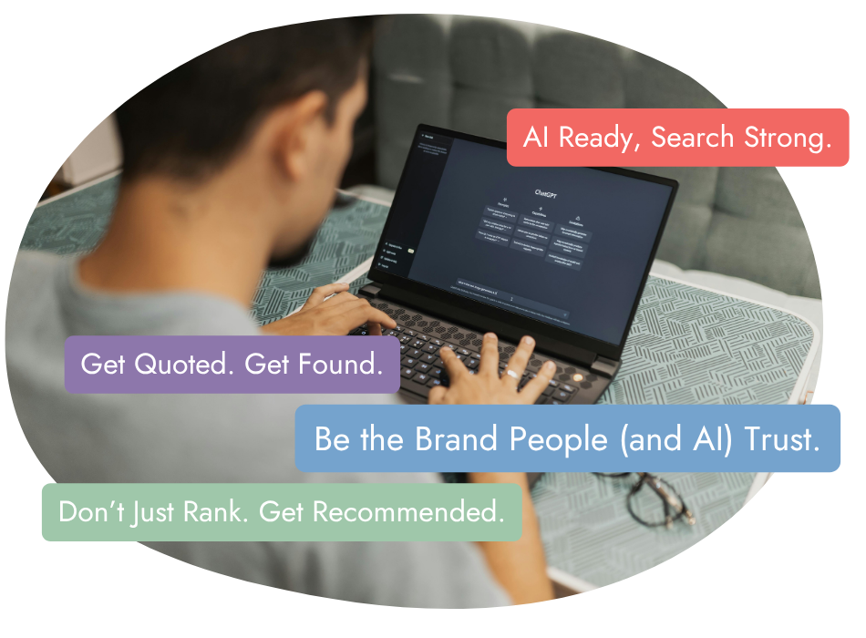 A person uses a laptop at a table, with on-screen text and colorful callouts reading: "AI Ready, Search Strong.", "Get Quoted. Get Found.", "Be the Brand People (and AI) Trust.", and "Don’t Just Rank. Get Recommended.